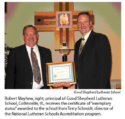 Principal Mayhew receiving Exemplary School Award